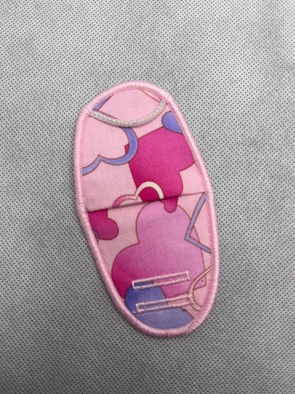 pink and purple hearts on pink. fits plastic and metal frames.